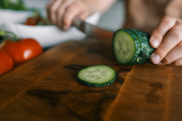 istock Child at table with leaf vegetables, a natural food ingredient 2158144410