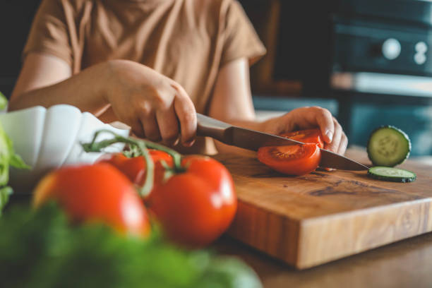 istock Child at table with leaf vegetables, a natural food ingredient 2158144419