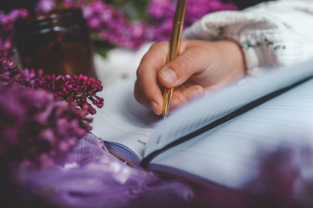 istock Girl writes in a notebook, aesthetics 2158144484