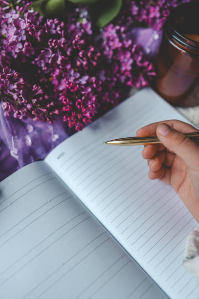 istock Girl writes in a notebook, aesthetics 2158144486