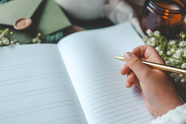 istock Girl writes in a notebook, aesthetics 2158145079