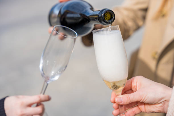 istock Two women's hands toasting with prosecco glasses. Festive occasions. 2158148217