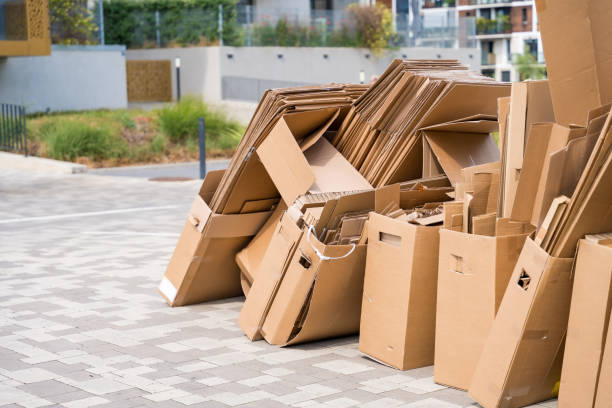 istock Pile of cardboard boxes ready for recycling outside a building 2158148220