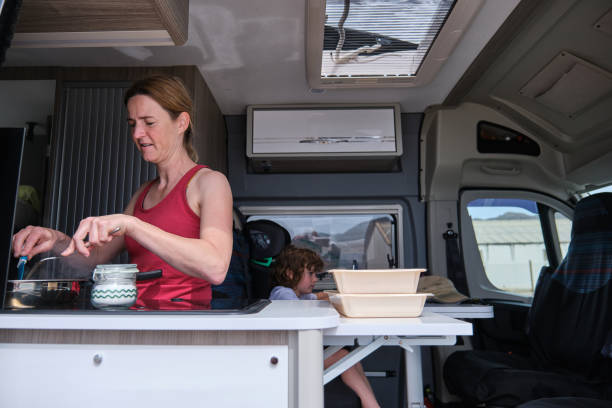 istock A woman with her son cooking in a camper van during summer vacation 2158150940