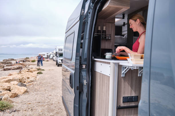 istock A Woman cooking in a camper van during her summer vacation 2158150976
