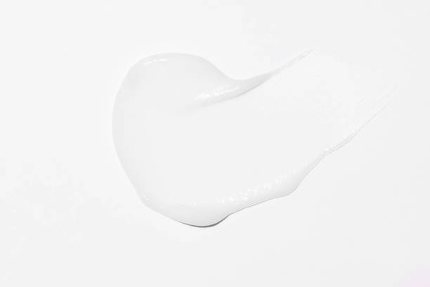 istock Face cream stroke isolated on white background. White exfoliation cream smear smudge sample. face or body skincare product swatch. showcase of the product 2158153235