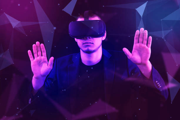 istock A Caucasian man wearing VR headset and immerses himself in a surreal,  Metaverse VR virtual reality game playing,  play metaverse virtual digital technology game control with VR goggle. 2158154359
