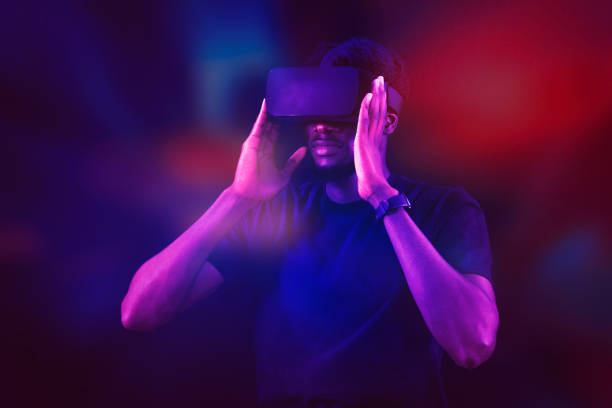 A Caucasian man wearing VR headset and immerses himself in a surreal,  Metaverse VR virtual reality game playing,  play metaverse virtual digital technology game control with VR goggle.