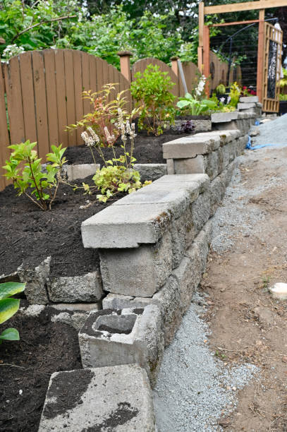 istock Rock wall construction with concrete building blocks for terracing garden, pathways, yard and patios 2158156099