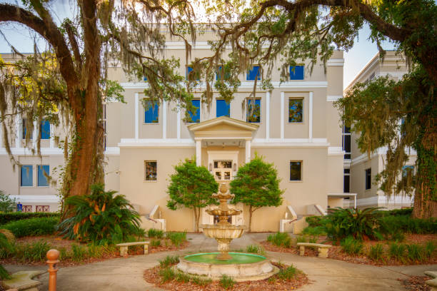 istock Building with tree and garden fountain scene. Long exposure 2158157748
