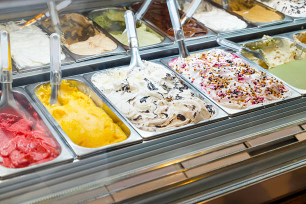 Various flavors ice creams in display freezer