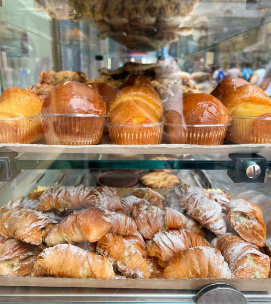 istock Croissants and Neapolitan rum baba in a bakery 2158158877