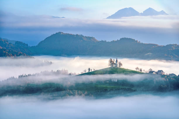 We arrived at the hills in the dark and patiently waited for sunrise.  The clouds and fog were moving fast, hiding the hills and church.  Amazed by the changing scenery, we captured the pink, bright sky when the sun rose.  It was the best morning we had during our Slovenia trip in 2019.