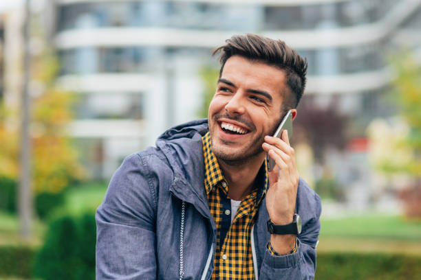 istock Young man talking to the phone 2158159487