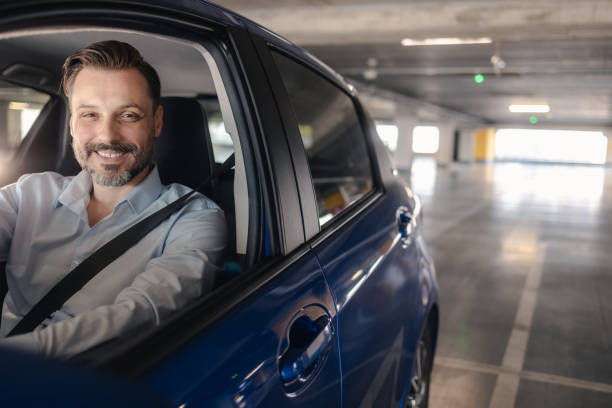 istock Happy male driver inside his car 2158160930