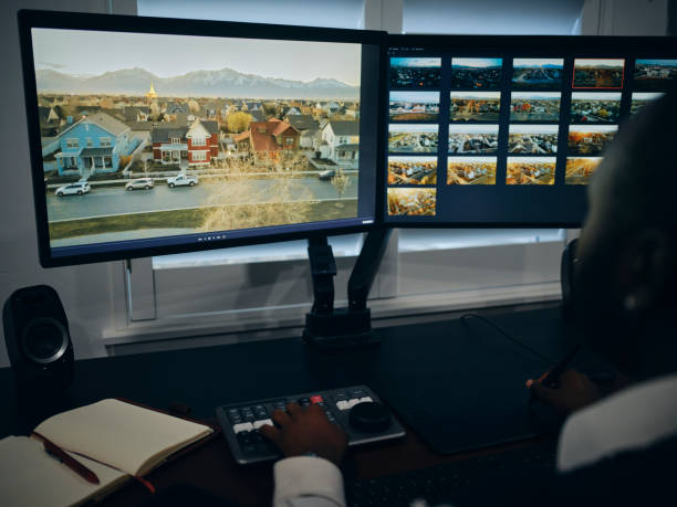 Freelancer Working in a Home Office A freelance creative professional working in a home office. photo editing screen stock pictures, royalty-free photos & images