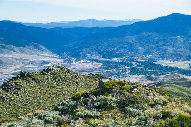 View of I-80 as it curves around heading up into the mountains in Verdi, Nevada. The Nevada/California border is just beyond the curve in the highway.