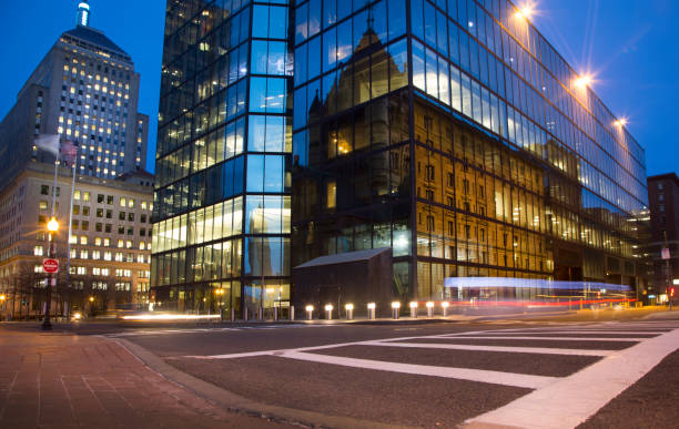 istock Illuminated city buildings at dusk 2158162750
