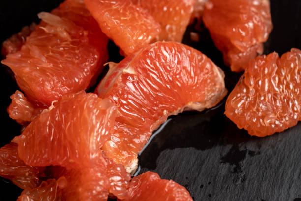 istock slices of peeled grapefruit close-up 2158166885