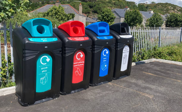 istock Recycle bins accepting a range of separated waste including paper, glass, plastics and general rubbish. Different colours to improve segregation. 2158167589