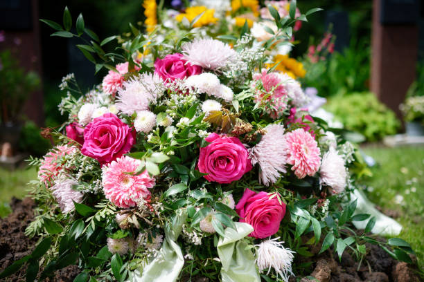 Vibrant flowers on fresh grave