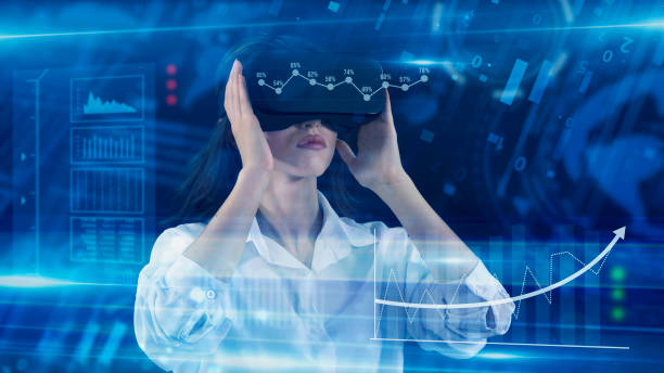 istock Business People, Employee wearing VR glasses and working on virtual holographic computer screen. Launching high-technological startup, Young engineer wearing vr headset. Technology concept. 2158171251