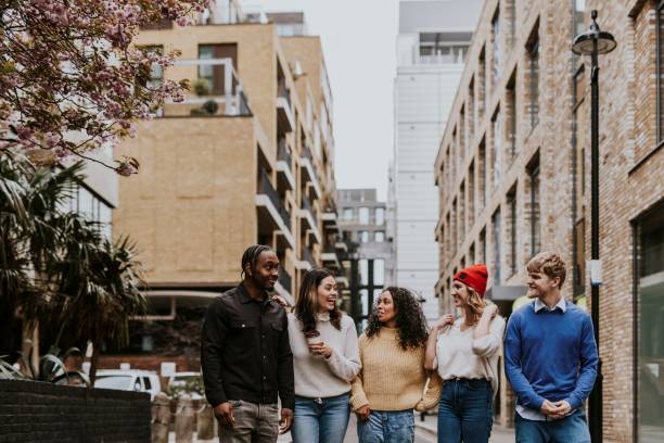istock Diverse friends hanging out in city 2158175819