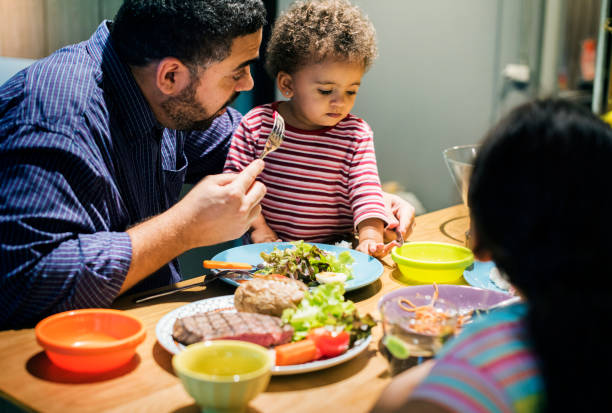 Family eating at the dining table together