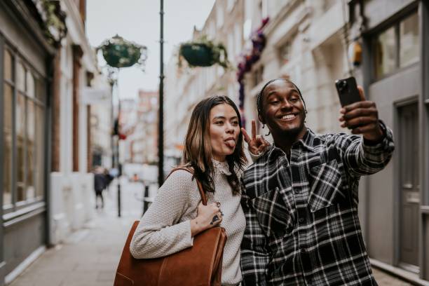 istock Couple taking selfies on smartphone 2158175858