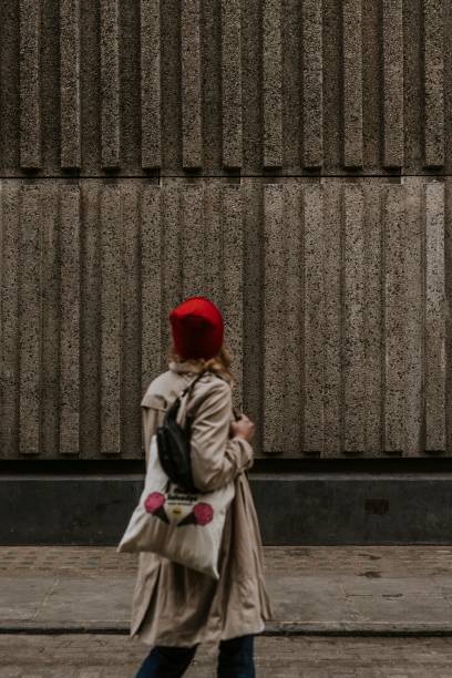 istock Blonde woman walking in city alone 2158176094