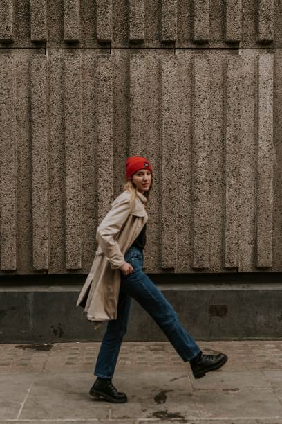 istock Blonde woman walking in city alone 2158176114