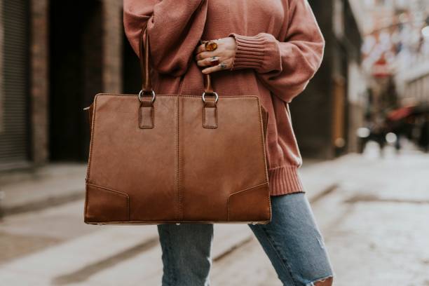 istock Women's brown leather tote bag 2158176122