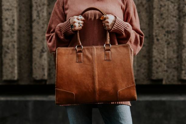 istock Women's brown leather tote bag 2158176124