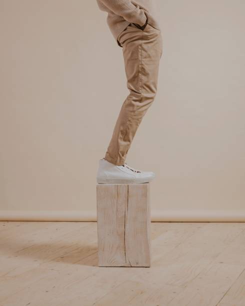 istock Men's khaki pants, white sneakers 2158176326