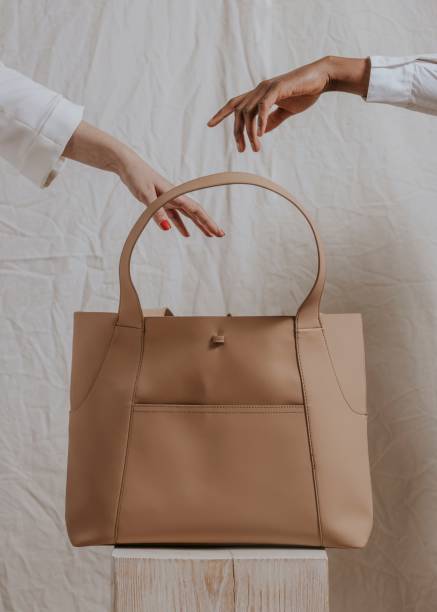istock Businesswoman's beige tote bag 2158177216