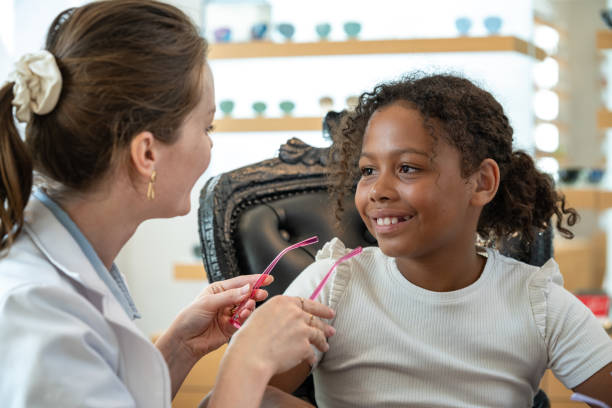 istock Buying glasses for a child at an optician 2158178972