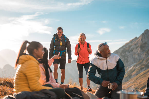 istock Diverse Friends Enjoying Fresh Air and Tea at Hill Summit 2158178985