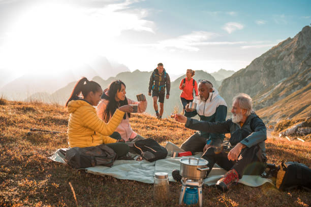 istock Diverse Friends Enjoying Tea Break on Hilltop 2158178991