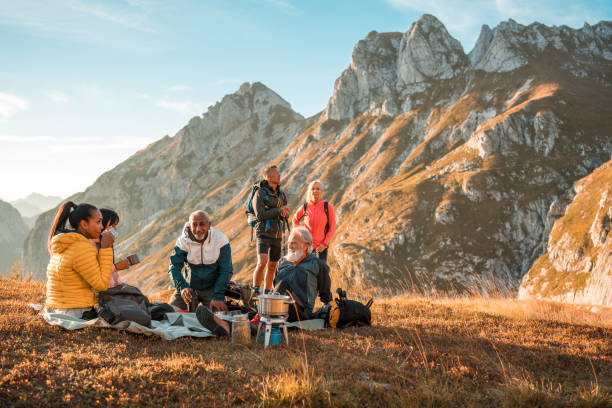 istock Diverse Hiking Group Drinking Tea at the Summit 2158179004