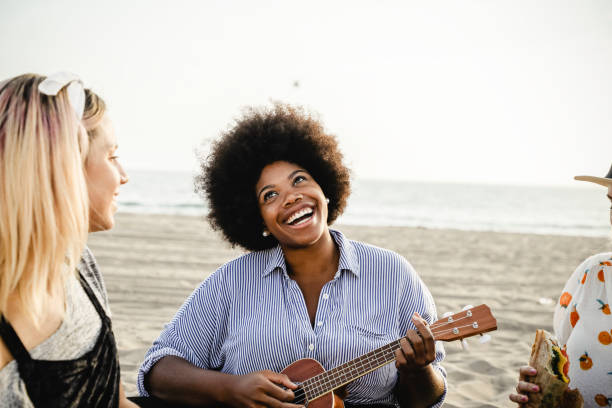 istock Musicians having a beach picnic 2158181662