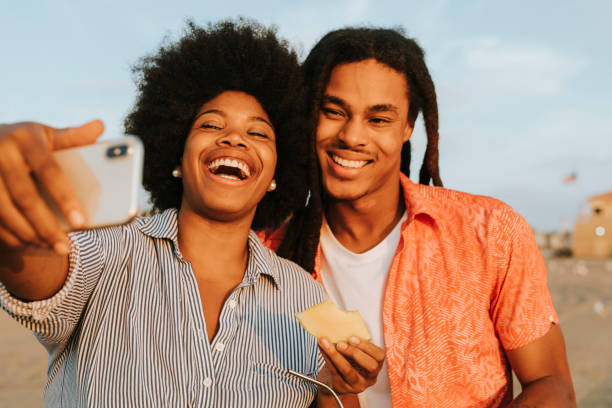 istock Lovely couple taking a selfie at the beach 2158181765