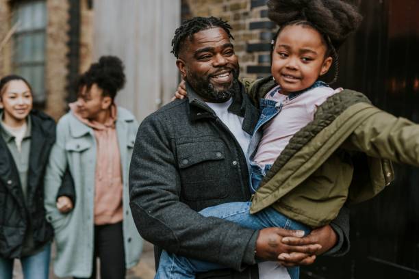 istock Dad carrying his daughter, walking in the city 2158183343
