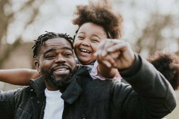 istock Happy dad carrying daughter on his back 2158183571