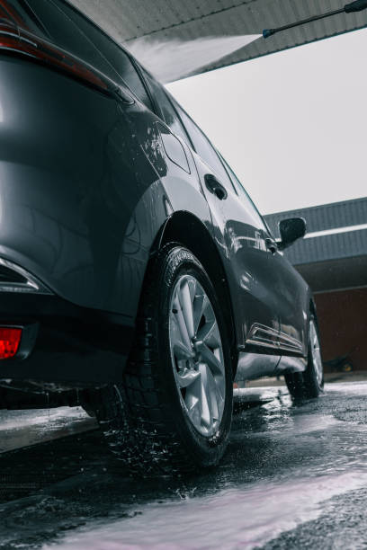 istock Car washing. Cleaning Car Using High Pressure Water 2158183867