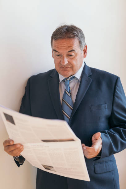istock CEO reading the morning newspaper 2158184261
