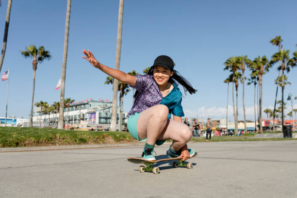 istock Happy girl skateboarding, fun outdoors sport activity 2158184694