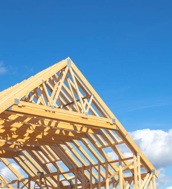 istock New residential construction home framing against a blue sky 2158184714
