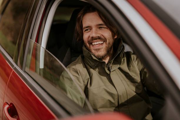 istock Confident man sitting in car photo 2158184870
