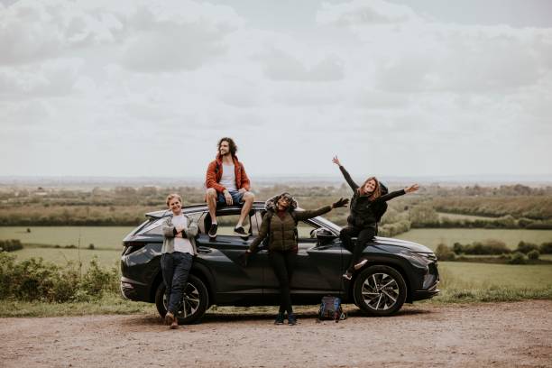 istock Friends enjoying road trip on hill photo 2158184890
