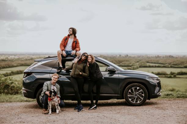 istock Friends enjoying road trip on hill photo 2158184897